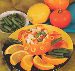 Салат из рыбы и овощей в апельсиновой корзиночке